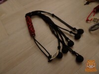 Black and red ball flogger 6 ball flogger in black with a red and black handle